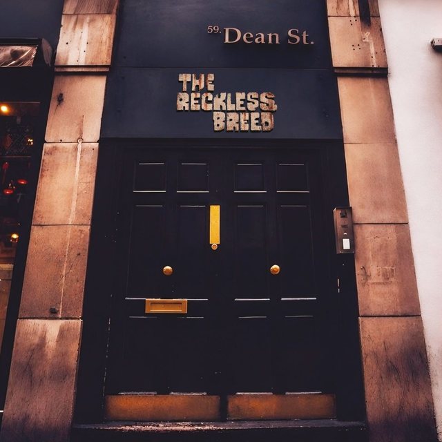 59. Dean St album sleeve — the doorway of Dean St. Studios, Soho, with The Reckless Breed wordmark above it